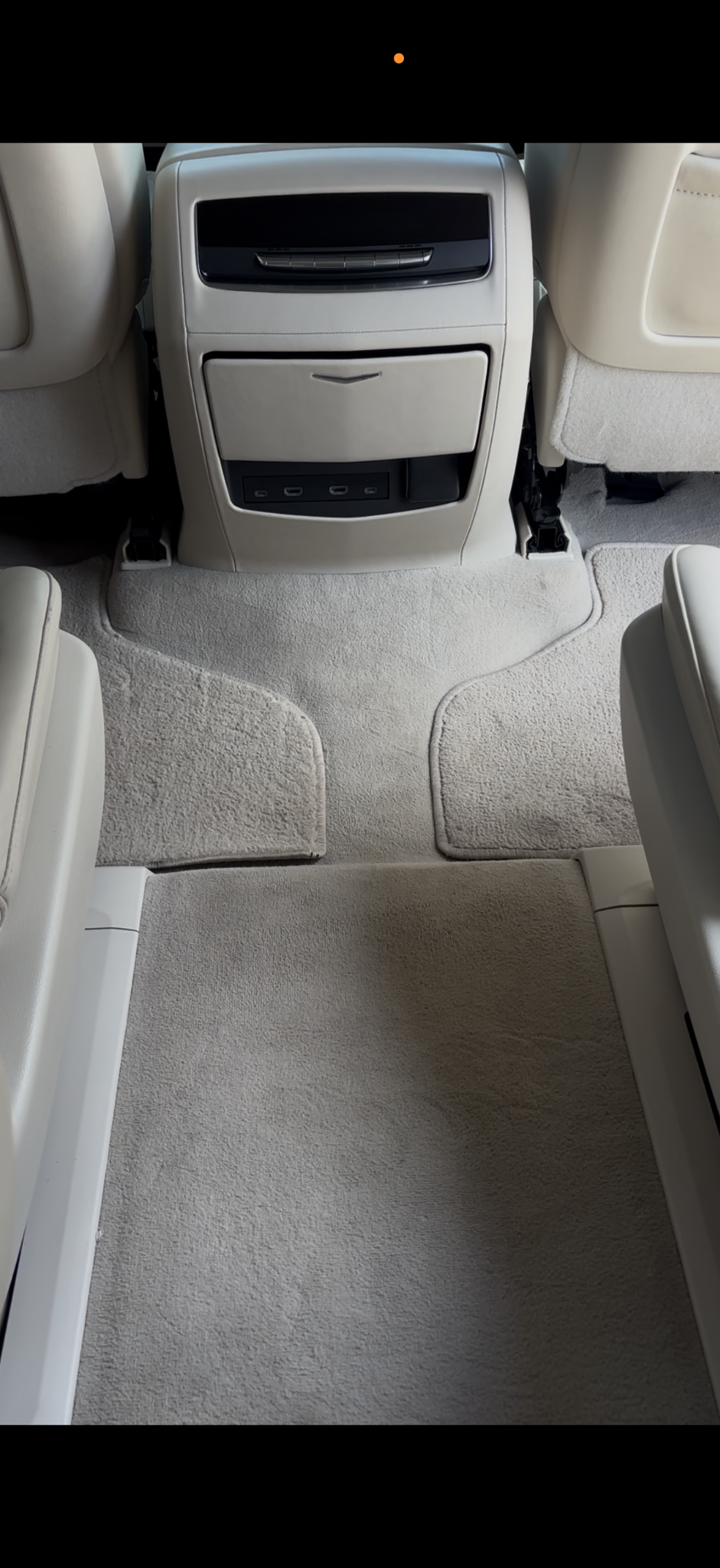 Clean rear cabin carpet and console after detailing